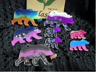 Handmade resin bear magnets in galaxy and aurora colors — mama bear and two cubs
